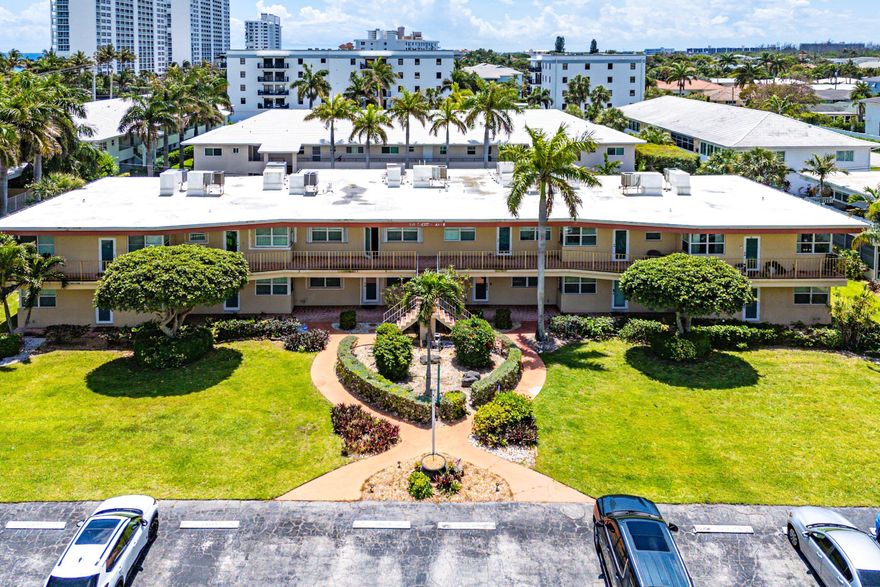 Location truly is everything. Just steps from the beach, this bright &  airy coastal-inspired 2-bedroom, 2-bath co-op offers the perfect blend of comfort and seaside charm. Enjoy ocean breezes from your spacious screened-in balcony. With nearly 1,100 total square feet (larger than tax records indicate) this beautifully updated residence features impact windows & doors, along with a modernized kitchen and bathrooms designed for easy, stylish living. Offered fully furnished for immediate enjoyment, this home also boasts a low HOA and is pet-friendly, making it an exceptional and rare opportunity this close to the beach. Ideally situated near shops, restaurants, and just minutes from vibrant nightlife of Deerfield Beach as well as the luxury and amenities of The Boca Resort and East Boca!