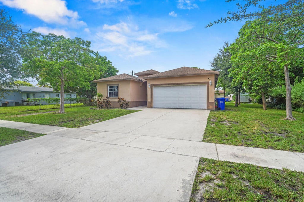 Photo of 2430 NW 13TH Street, Pompano Beach, FL 33069 (MLS # B26061769)