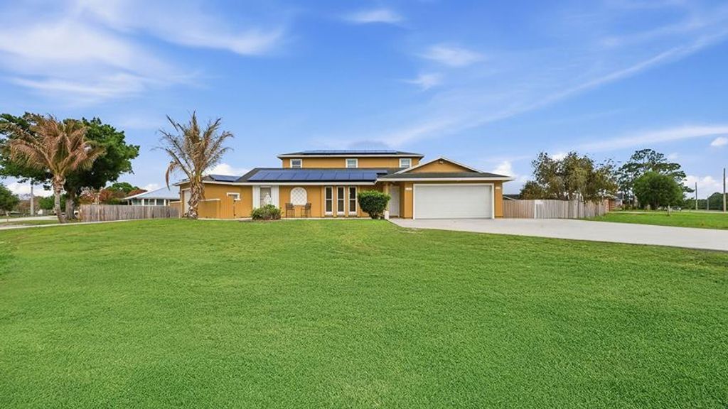 Photo of 2301 SW Barber Lane, Port Saint Lucie, FL 34984 (MLS # B26012448)