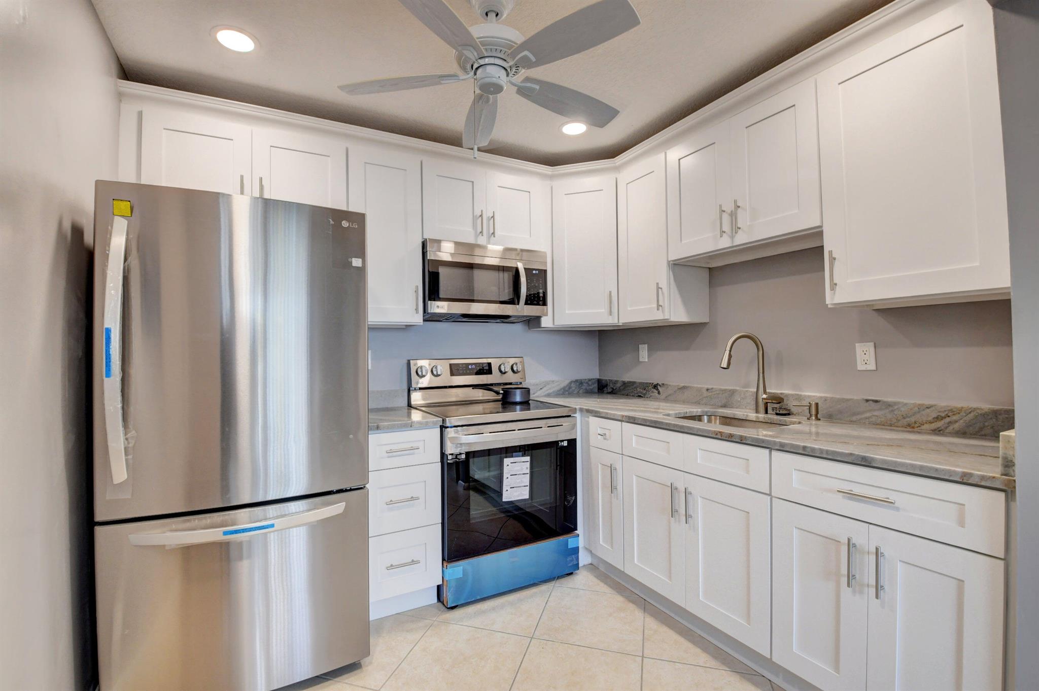 Walking distance to House of Worship remodeled 2nd floor condo. Spacious floor plan with attractive finishes & ample closet space. Gorgeous kitchen features Shaker-style cabinetry, stainless steel appliances. Relax in the spacious owner's suite with direct balcony access & en suite bath with cabinet-style vanity shower/tub combo. Enjoy your covered, screened balcony for a sheltered spot that's perfect for extra seating or dining. You'll love the amenities of Kings Point including two 18-hole golf courses designed by Robert Trent Jones, Sr.; swim & tennis, exercise studio. Enjoy state-of-the-art theatre with spectacular shows plus clubhouse dining in East End Cafe & The Bistro. Manned gate, security features & courtesy shuttle for comfort & convenience.