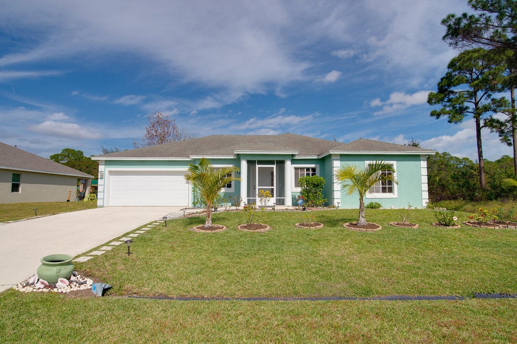 Photo of 1809 SW Janette Avenue, Port Saint Lucie, FL 34953 (MLS # R10777915)