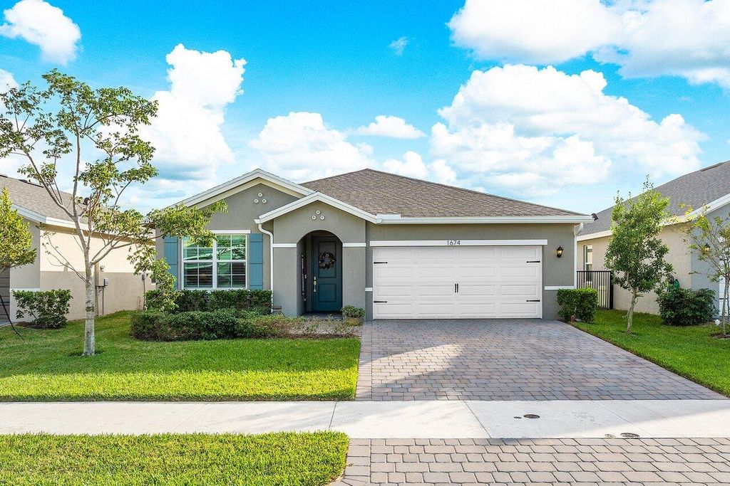 Photo of 1674 NE White Pine Terrace, Jensen Beach, FL 34957 (MLS # R10850792)