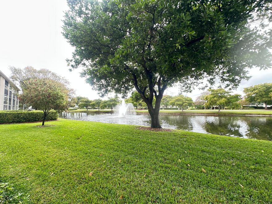 Welcome to Wynmoor Village, a gated 55+ comm in Coconut Creek known for its resort-style amenities & vibrant, social lifestyle. WATERFRONT 2BR/2BA Condo - Priced to Customize!  Enjoy serene canal views from this spacious 1st fl unit, perfectly located just steps from pool. Features incl an orig kit & baths—ideal for buyers looking to update & make it their own. Kit incl ss microwave & refrigerator, white range & dishwasher & a convenient pantry for ext storage! Ceramic tile flows thru the kit, entry, dining area & hallways, with lam flrs in liv rm & bedrms. Addt'l highlights incl shower stall in guest bath, a stackable washer/dryer, encl patio w/exit door & beautiful water view! Residents enjoy tennis, pickleball, Golf, a 50,000+ sq. ft. clubhouse w/gym, clubs, classes & much more!