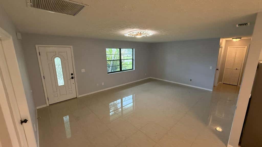 Photo of 1832 SE MANTH Lane, Port Saint Lucie, FL 34983 (MLS # B26064375)