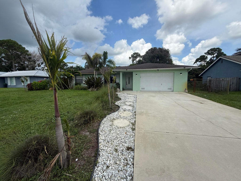 Photo of 1832 SE MANTH Lane, Port Saint Lucie, FL 34983 (MLS # B26064375)