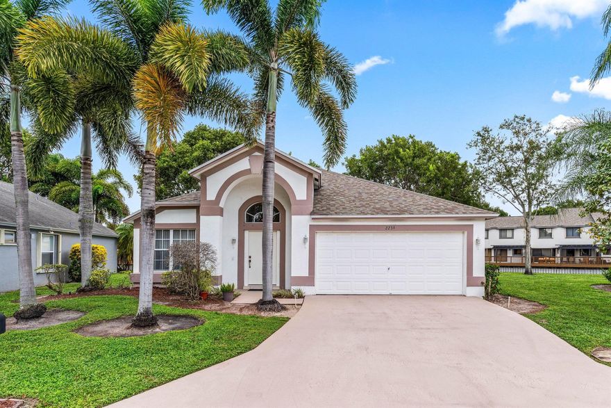 ALL AGES WELCOME!  Enjoy serene lake views from this beautifully maintained 3-bedroom, 2-bathroom home with a spacious 2-car garage. The split open floor plan features vaulted smooth ceilings and stylish new tile flooring with updated baseboards throughout. Major systems have been thoughtfully upgraded: roof replaced in 2020, air conditioning in 2022, and water heater in 2015--offering peace of mind and energy efficiency.  Nestled in a gated community, this home offers unbeatable convenience--just minutes from schools, the public library, Publix and Bodegon grocery stores, local dining, parks, Palm Beach International Airport, Wellington Mall, Wellington Hospital, and easy access to both I-95 and the Turnpike. The amenities for everyone to enjoy. 2 pet allowed no size or weight restriction