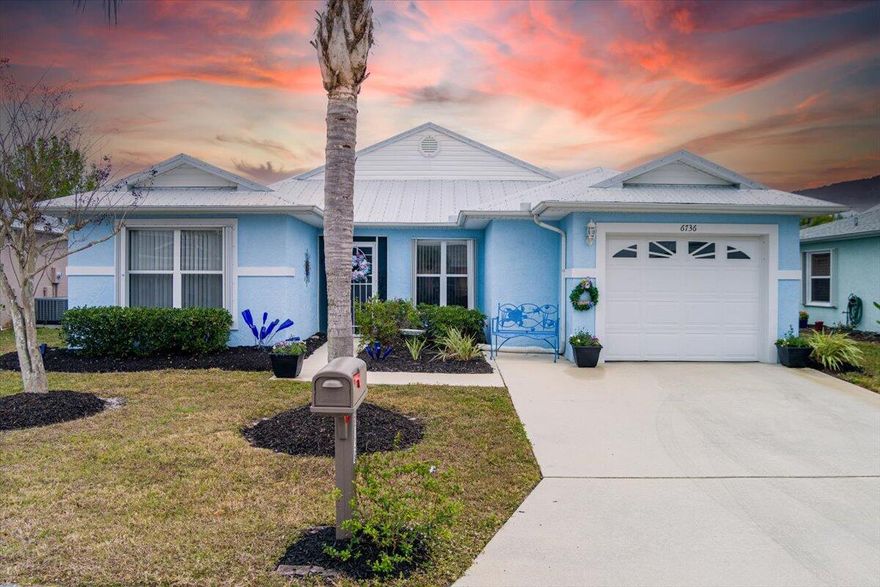 Come see this beautiful CBS home located in the desirable 55+ community of Spanish Lakes Fairways! This well-maintained residence features a newer METAL ROOF (2022), Accordion storm shutters, Water Heater (2021), and an A/C system serviced yearly for peace of mind. Enjoy a monthly land lease of just $561 and spacious living with two large bedrooms and two full baths. The home backs up to a private, landscaped yard and offers a large outdoor patio plus an enclosed Florida room, perfect for relaxing or entertaining. Beautiful landscaping with a welcome feeling. Updated laminate-plank flooring throughout. Wonderful amenities including  Pickleball, Shuffleboard,18-hole Golf Course, Tennis Courts, 2 Heated pool, Club house, library and more. Schedule your tour today!