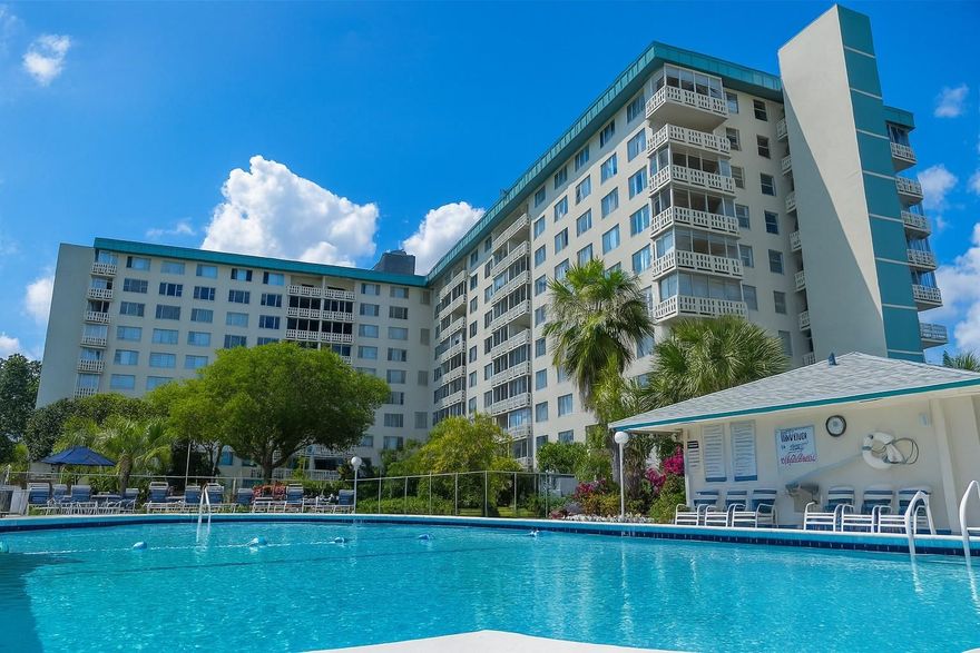 Beautiful, light, bright and spacious remodeled unit in a well-managed community near beaches, downtown, dining, and shopping. This move-in-ready unit, virtually staged with a coastal flair, offers the ideal combination of style, comfort, and location. Lots of closet and cabinet space. Eat in kitchen with SS appliances. Tiled flooring throughout. Enclosed balcony with impact windows offers extra living space for an office or small guest room. Original half bath has been incorporated to create a larger, more open primary bathroom with a step-in shower for improved functionality and space. 24/7 security. Resort-style amenities include a heated pool, walking trails, clubhouse with full kitchen and outdoor bar/BBQ area. Tennis and pickleball memberships available. 20% down. Cats OK. No lease.