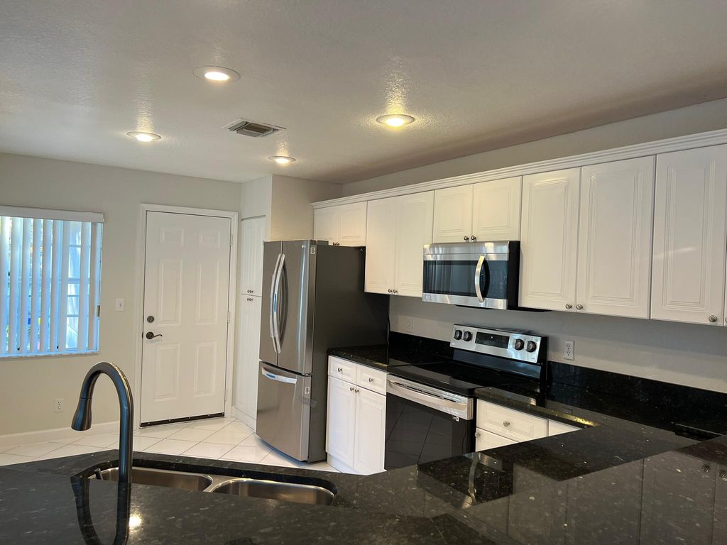 Photo of 1275 E Lancewood Place, Delray Beach, FL 33445 (MLS # R11160115)