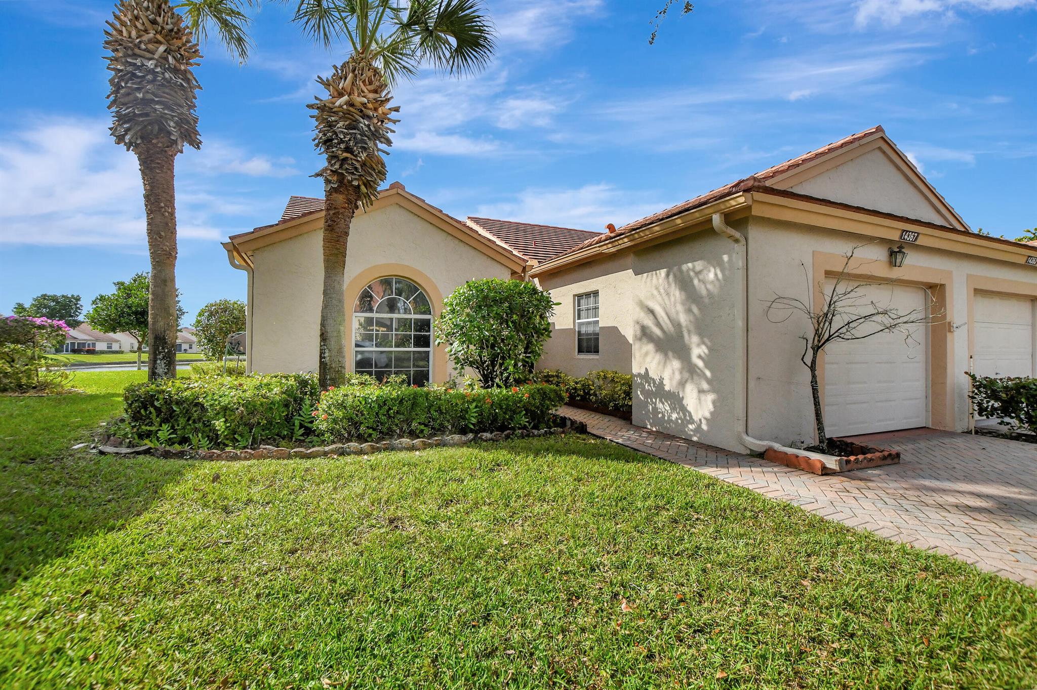 CORNER VILLA ON THE LAKE with lanai facing West for beautiful sunsets; 2BR PLUS a Den/Office; Tile throughout main living area and kitchen; wonderful Active, 55+ community with walking distance to the pool, clubhouse, and tennis courts. PRICED TO SELL!