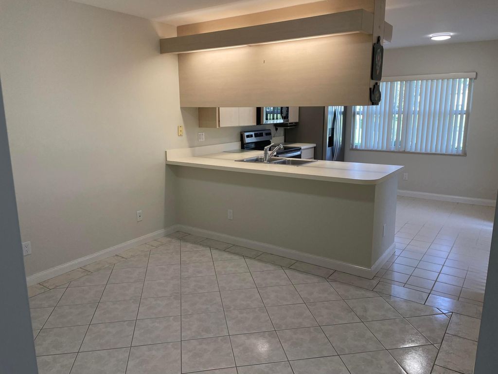Photo of 43 Essex Court #A, Royal Palm Beach, FL 33411 (MLS # B26020041)