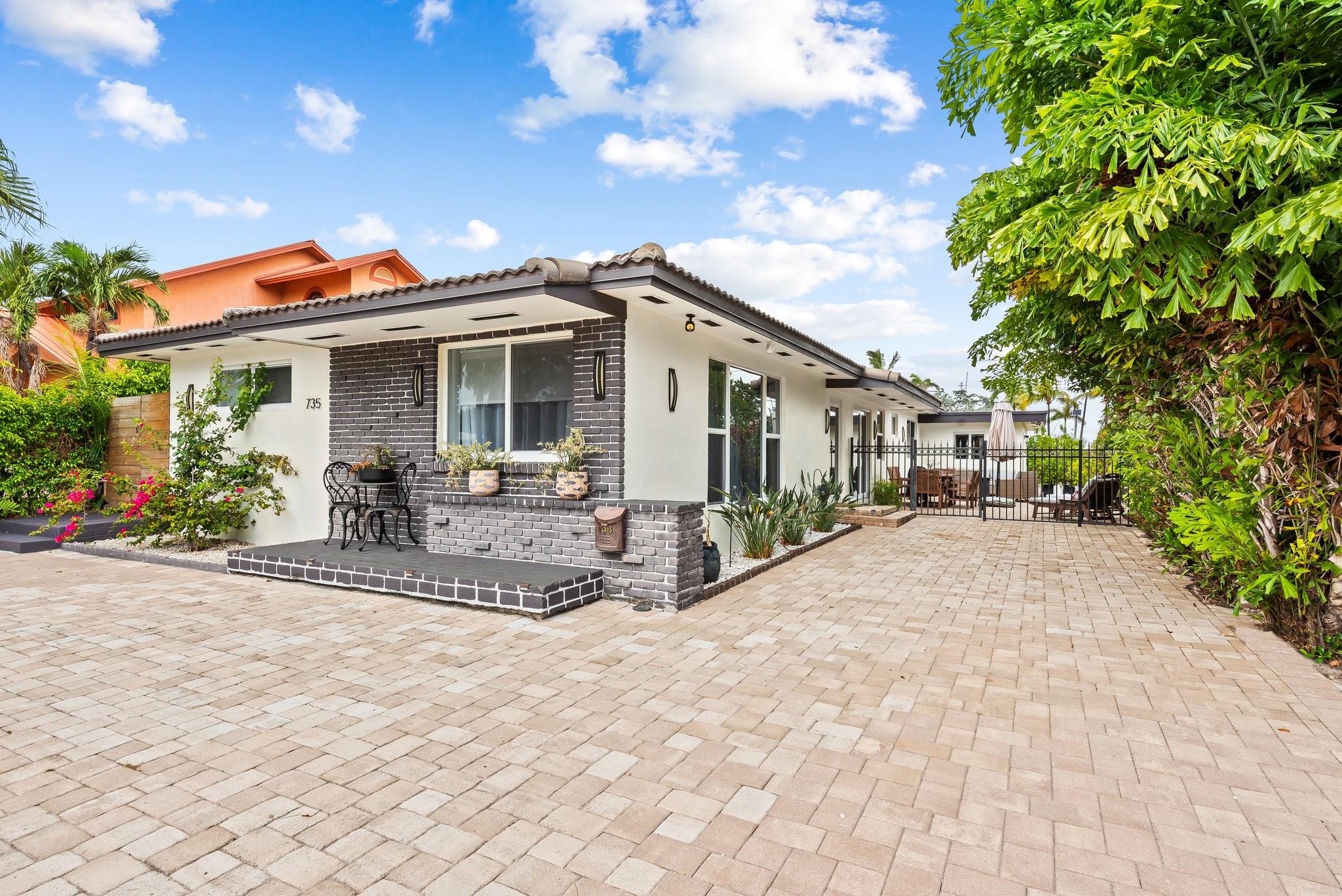 Welcome to your home by the sea! Just a short stroll to the beach and a boat marina practically in your backyard. Step inside to this beautiful remodeled 4 bedroom home with an open concept layout. At the heart of the home, the expansive kitchen with modern finishes and ample counter space. You will also find a versatile office/den space, perfect for working from home or creating a reading nook. Enjoy the outdoor patio spaces with the breeze coming in off the intracoastal. Boat parking in the back for your boat as well. Whether you are looking to enjoy weekend boating, daily walks beach walks or simply unwind in a serene setting, this home offers it all.