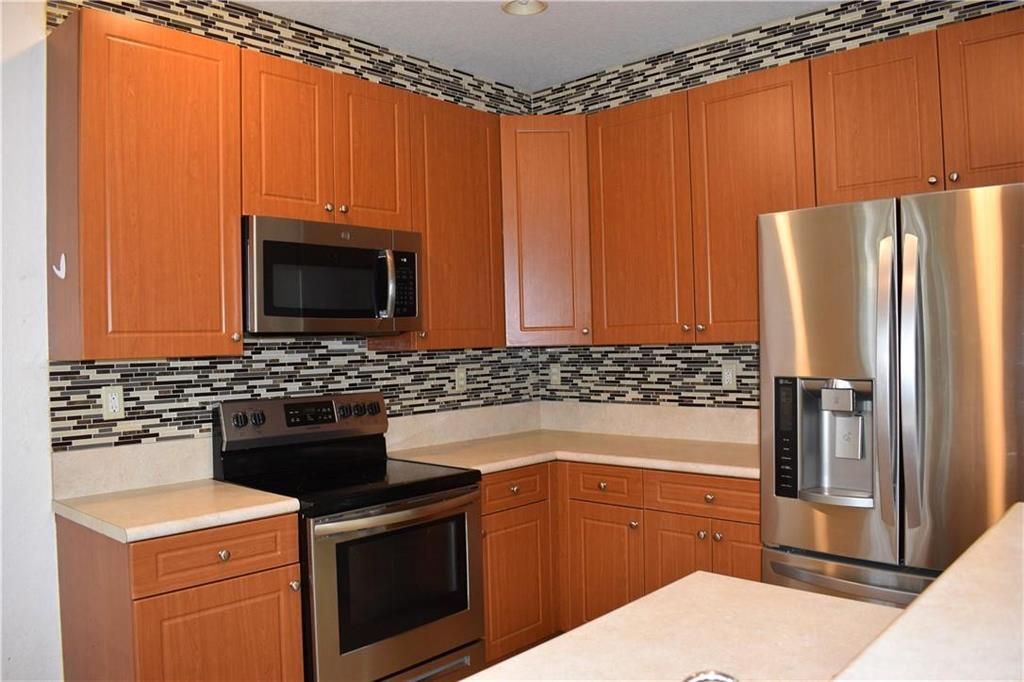 Photo of 2851 W Prospect Road #1211, Tamarac, FL 33309 (MLS # B26030170)