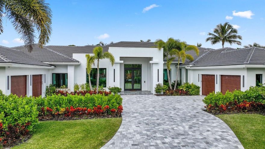 Nestled within the prestigious gated community of Long Lake Estates, this newly constructed contemporary architectural masterpiece offers an unparalleled opportunity to own a true trophy property. Situated on an acre plus and spanning over 7,400 interior square feet of meticulously curated living space, this one story exceptional estate seamlessly blends modern sophistication with timeless elegance. After entering through 10 foot high glass doors, a striking statement entry foyer welcomes you into a grand great room and living area, with oversized porcelain floors and floor-to-ceiling windows showcasing breathtaking views of the resort style backyard. Designed for both relaxation and entertaining, this property seamlessly blends indoor and outdoor living at its finest. This expansive home boasts 5 bedrooms, 6 full baths, a half bath, along with a state-of-the-art home theater and a spacious 4 car garage. Every bedroom suite features oak flooring, custom closets, stunning bathrooms and is thoughtfully designed with meticulous attention to detail, offering both comfort and sophistication. The primary suite is a true sanctuary, showcasing unparalleled style and luxury. Oak flooring and floor-to-ceiling glass doors lead to an oversized private patio. His-and-her spa-inspired bathrooms are connected by a stunning glass-enclosed shower, while the suite also features tremendous custom his-and-her walk-in closets and a private sauna for the ultimate retreat. The chef's kitchen is a true masterpiece designed for both function and style equipped with top-of-the-line appliances, by SubZero, Wolf, Bosch and Miele ensuring effortless functionality and luxury at every turn. At its heart, a massive center island provides ample workspace, under-storage, and casual dining. Dropped backlit ceilings enhance the ambiance, while sleek, soft-touch wood veneer cabinets offer both beauty and practicality. Completing this extraordinary kitchen is an adjacent walk-in pantry, offering additional storage and organization to keep everything within easy reach. The elegant dining room with a stunning matchbook quartz feature wall is complemented by two stunning glass-enclosed, temperature-controlled wine displays, creating a sophisticated ambiance for wine enthusiasts. An oversized great room serves as the heart of the home, featuring a stunning porcelain accent wall and a sleek propane fireplace, creating an inviting ambiance. The open-concept dining area connects to the outdoors through expansive glass sliding doors, offering effortless indoor-outdoor living. Step outside to a true entertainer's paradise, boasting three covered patios, a resort-style pool and spa, a cozy fire pit, and a fully equipped summer kitchenperfect for hosting gatherings or enjoying tranquil evenings in your private oasis.