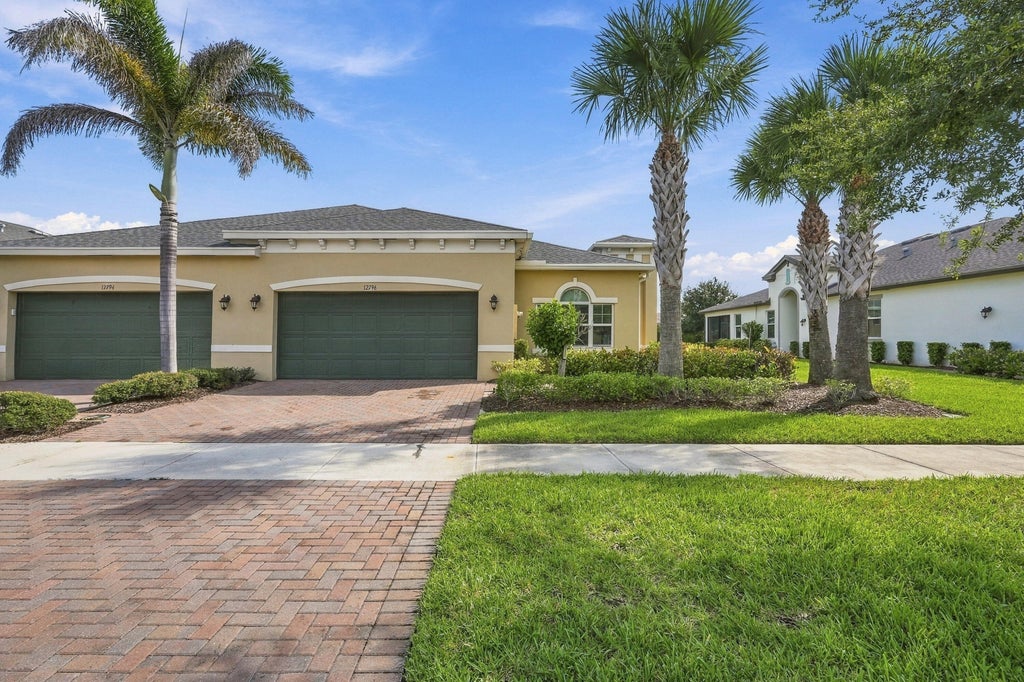 Photo of 12796 SW Lake Fern Circle, Port Saint Lucie, FL 34987 (MLS # B26079664)