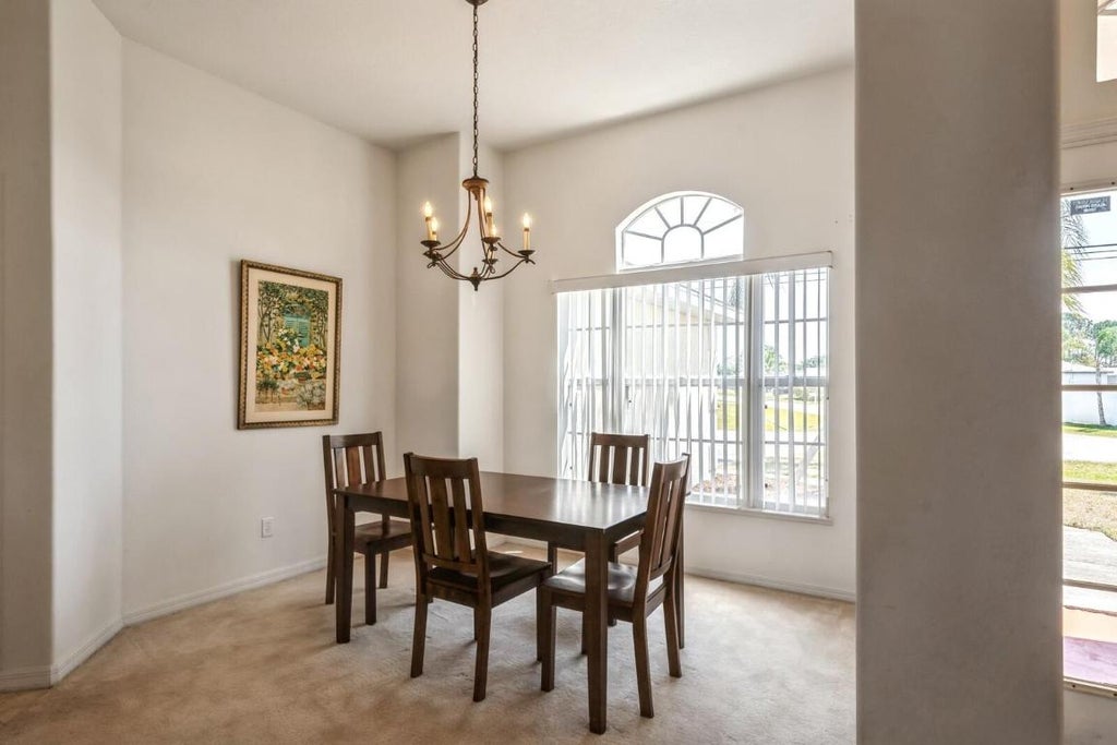 Photo of 297 SW Whitmore Drive, Port Saint Lucie, FL 34984 (MLS # R10989106)