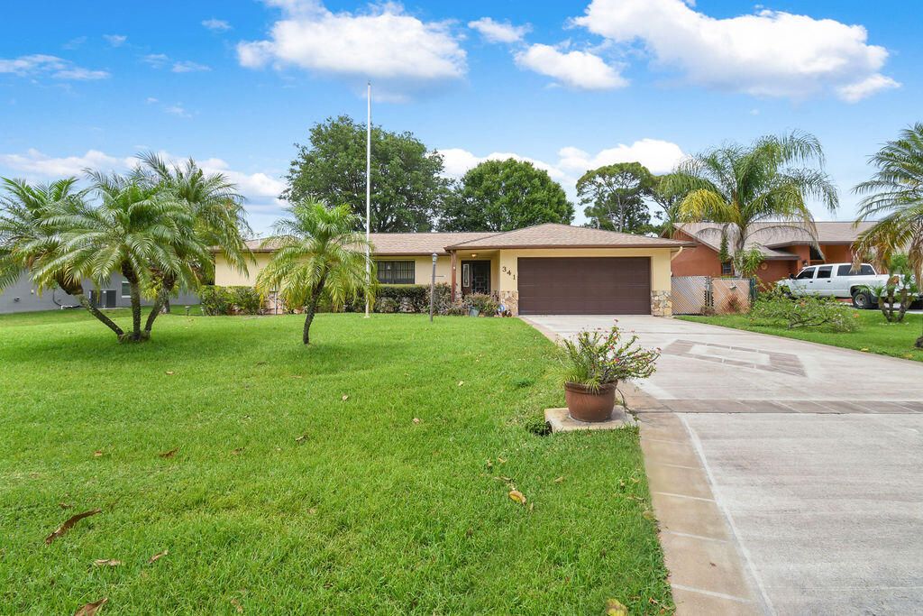 Photo of 341 NE Gulfstream Avenue, Port Saint Lucie, FL 34983 (MLS # R10790346)