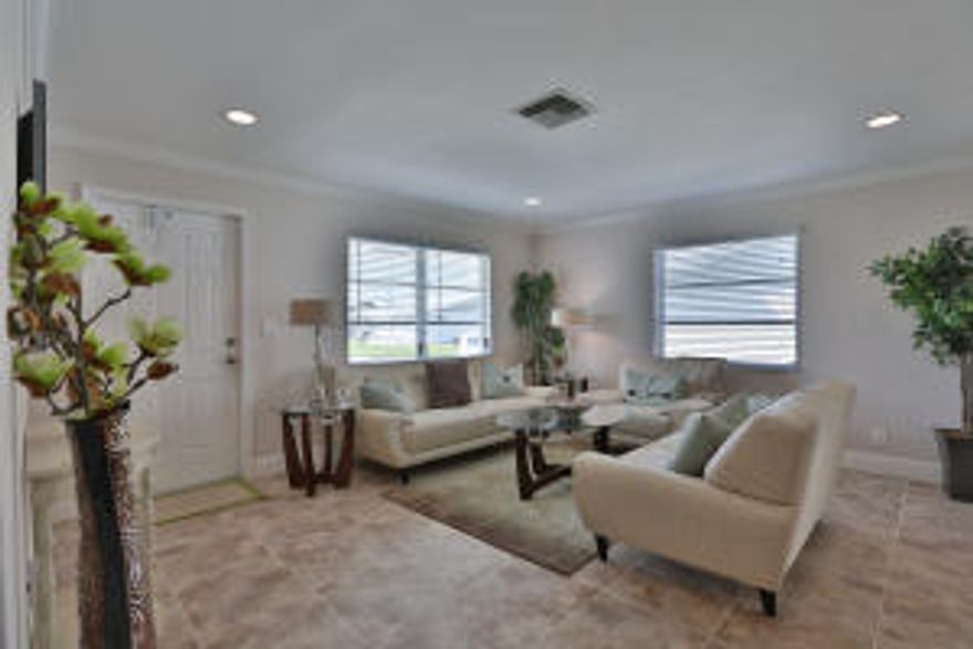 NEW NEW NEW - New Shaker style kitchen cabinets with crown molding, upgraded recessed lighting, Ice White granite counter-tops, brushed marble back-splash, upgraded Frigidaire Gallery Series stainless steel kitchen appliance package. New AC, hot water heater, and fully remodeled bathroom with granite counter-top and brushed marble tile wall surround. New crown molding in the main areas and smooth ceilings, 18'' ceramic tile and 5.5'' baseboards throughout. New ceiling fans and beautiful wood laminate flooring in the bedrooms. Fresh exterior and interior paint and all brushed nickel plumbing fixtures in the kitchen and bathroom. Only 2.5 miles to the beach - this is truly a must see property!