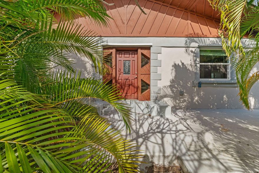 2 acres in Loxahatchee Groves, this CBS home offers a true country lifestyle with rare convenience. A 4 stall concrete barn is attached to the home under a brand-new 2025 metal roof, allowing direct access from the house through the spacious garage--making daily feeding and horse care easy without going outside. The open great room and cozy country kitchen with warm wood cabinetry support comfortable living. Updates include a 2019 AC, new water pump and pressure tank (2025), and a whole-house generator with owned propane tank. The barn features four 10x12 stalls with drains, a tack room, large feed/equipment storage room, and dividable stalls with removable wood slats. Riding ring, two paddocks, additional storage shed, and full 3-rail fencing with hot wire.