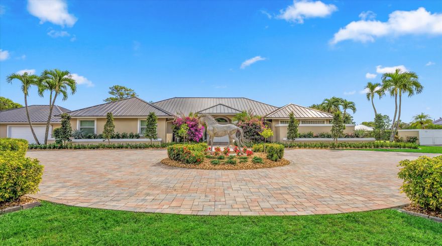 This inviting 3-bedroom, 3-bath single-family home sits on 2.54 acres and blends comfort with equestrian living. Tile flooring and volume ceilings enhance the open-concept layout, featuring a kitchen with family room and breakfast nook. Entertain with ease in the billiard room with bar or outdoors on the large screened-in patio with summer kitchen, pool, and spa. Equestrian amenities include a 3-stall barn with feed room, laundry, and groom's quarters with kitchenette and full bath, plus an additional stall near the paddock. Three paddocks and an arena with dressage mirror complete this exceptional property.