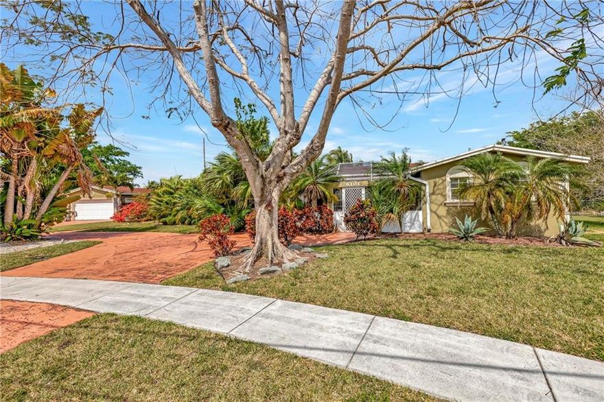 OVERSIZED DOUBLE LOT, NO HOA, separate detached 2 car garage, parking for up to 8 vehicles in the circular drive. Open floor plan, updated kitchen with dining area and granite, tile floors throughout, updated bathrooms, 4 bedrooms and 1 bedroom guest house, enough room for your large family and friends. Extremely private yard space with views of water and pool with new Diamond Brite in 2020. Additional separate studio apartment/guesthouse with bathroom just off the pool. This space is perfect for multi-generational family or opportunity for additional income, mature landscaping, , screened in sitting area and new paint. Roof 2008, water heater 2005, Outside AC 2021, inside unit 2005. Close to shopping, restaurants, schools and airport. Lot size over 16,000 sq ft.