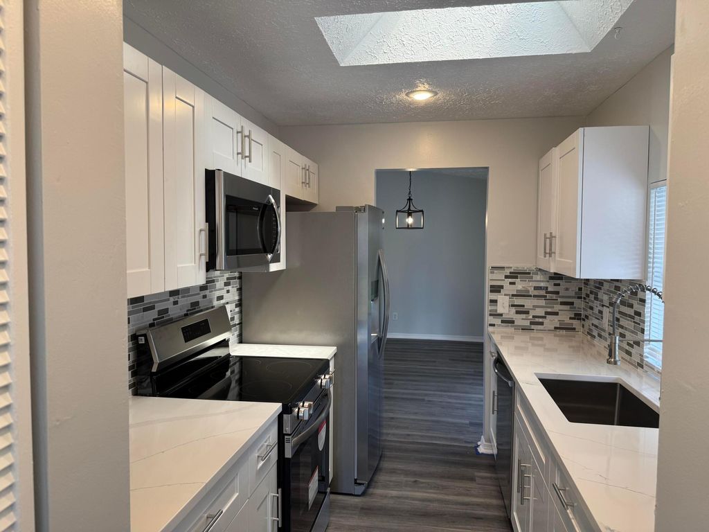 Photo of 590 NW Sherbrooke Avenue, Port Saint Lucie, FL 34983 (MLS # R11071644)