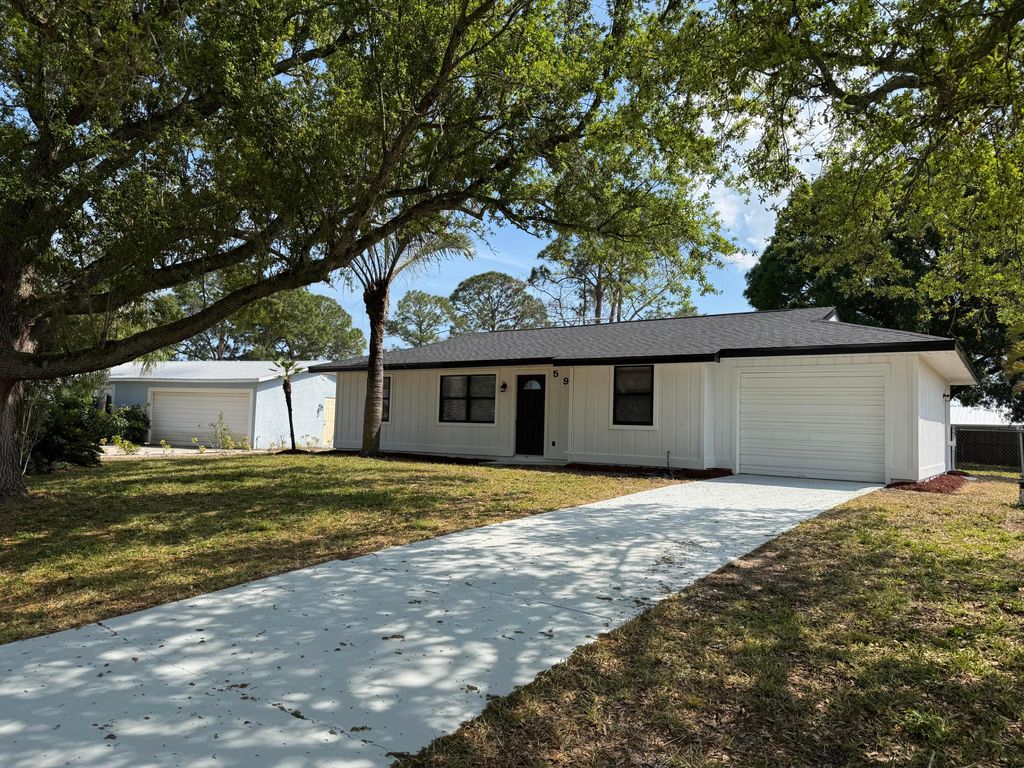 Photo of 590 NW Sherbrooke Avenue, Port Saint Lucie, FL 34983 (MLS # R11071644)