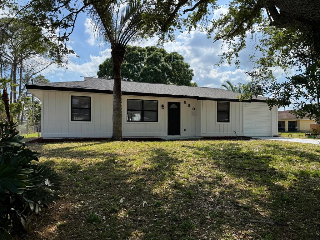 Photo of 590 NW Sherbrooke Avenue, Port Saint Lucie, FL 34983 (MLS # R11071644)