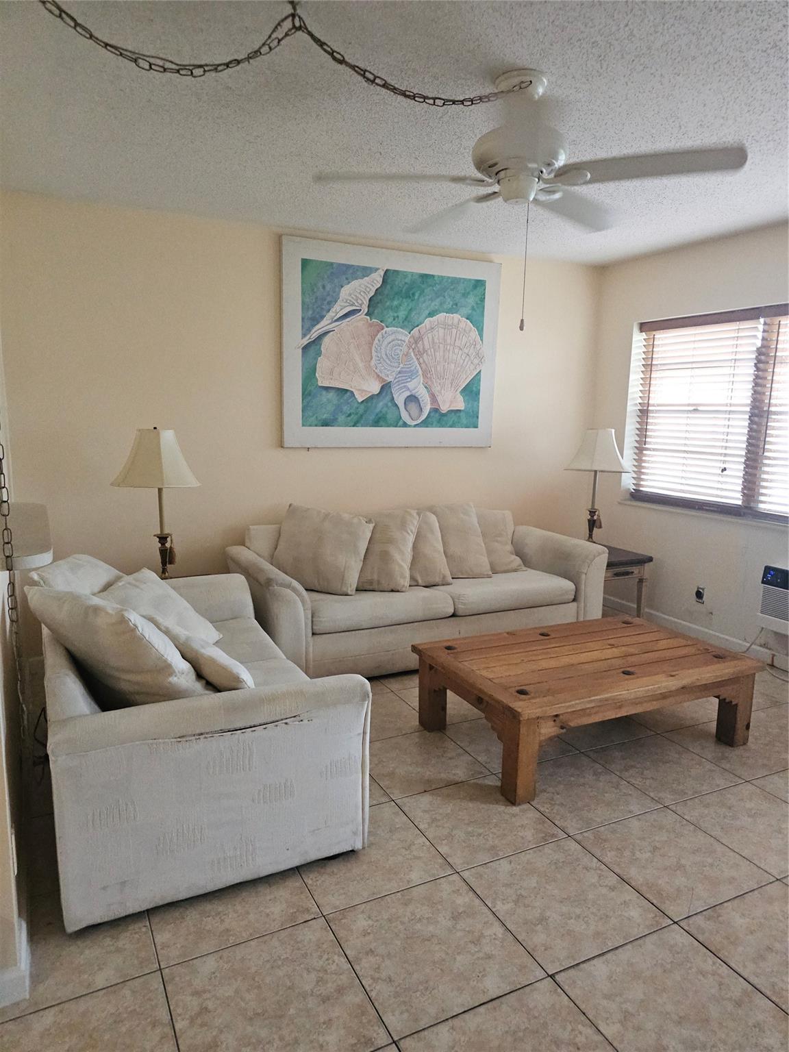 First-floor apartment furnished with tile throughout and featuring a laundry facility in the building. Enjoy resort-style living and amenities, including pools, a fitness center, a clubhouse, tennis, pickleball, and transportation service. Don't miss the opportunity for a carefree life. Close to all major shopping, restaurants, outdoor cafes, and the intercoastal, approximately six miles to the beach, and it typically takes 15 minutes. Close to the Florida Turnpike and Interstate 95.