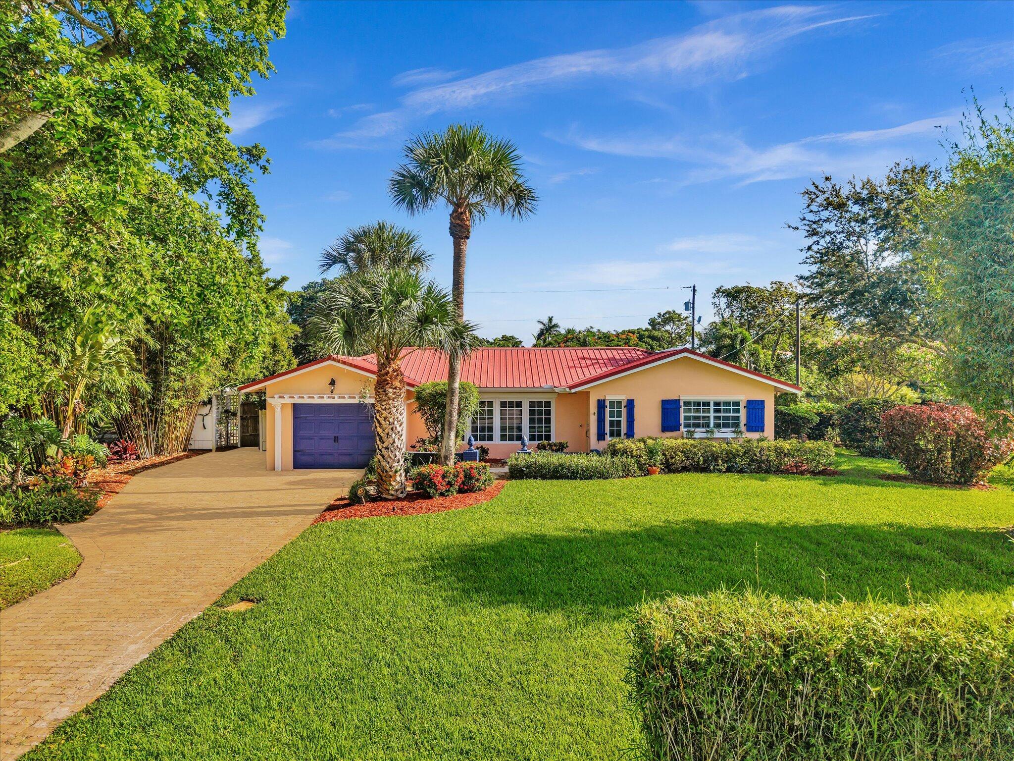 Vacation Living Meets Smart Investment. This .37-acre retreat blends resort-style living with income potential--no HOA means short-term rentals are welcome. Enjoy a sparkling pool, pool house, outdoor kitchen, and lush gardens with mature landscaping and fruit trees which backs up to a canal. Inside, the boho-inspired interior showcases an airy open layout with terrazzo flooring, a sunlit living room, and a modern eat-in kitchen with SS Appliances and a sleek breakfast bar--all seamlessly connecting to the family room with tranquil views of the backyard.Sunny bedrooms and well-appointed baths add comfort. Space for boat storage. Minutes from beaches, golf, & vibrant Delray Beach's Atlantic Avenue--perfect as a personal escape, working remotely and as an income producing asset.