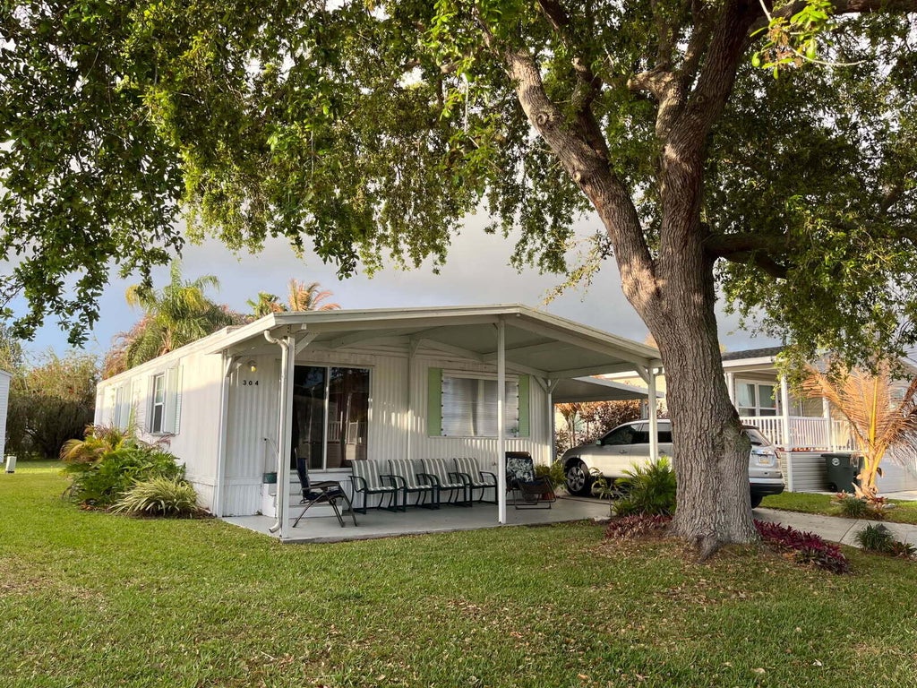 Photo of 304 Mockingbird Ave, Fort Pierce, FL 34982 (MLS # B26070300)