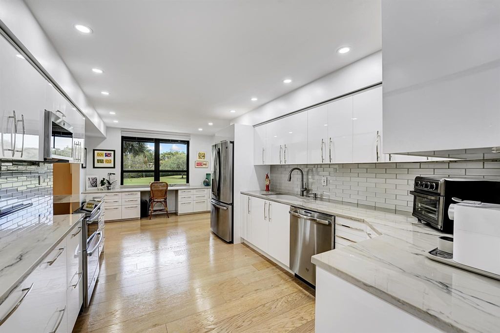 Photo of 7578 Regency Lake Drive #201, Boca Raton, FL 33433 (MLS # R11080806)