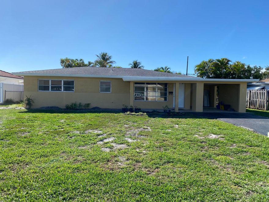 Amazing opportunity to live in East Boca Raton! Just a short drive or bike ride to Downtown and the Beach. Two bedroom home with large backyard.  Tile Floor in the living room, kitchen and baths. Laminate flooring in the bedrooms. Large laundry room. All A-rated schools. Move fast on this one!