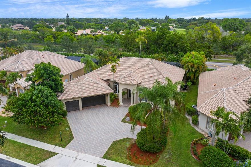 Magnificent and spacious home 4 BRs plus an office,3.1/2 Bathrooms overlooking the extra-large swimming pool and garden area.
This beautiful home features vaulted ceilings, very nice floorplan, cherrywood kitchen, granite countertop, wood floors,3-car garage, swimming pool with a fountain, spacious screened in patio, great for entertainment. This fabulous home is located in the very desirable community of Boca Falls within the A-Rated school district. Boca Falls has two Manned- gated entrances,The residents of Boca Falls enjoy the so many amenities it offers, Clubhouse, large resort-style swimming pool, tennis courts, fitness center, basketball court, children playground, and much more. This absolutely gorgeous home is a MUST See!!!!