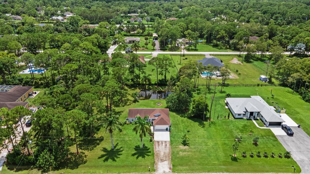 Photo of 16396 71st Lane N, The Acreage, FL 33470 (MLS # R11012028)