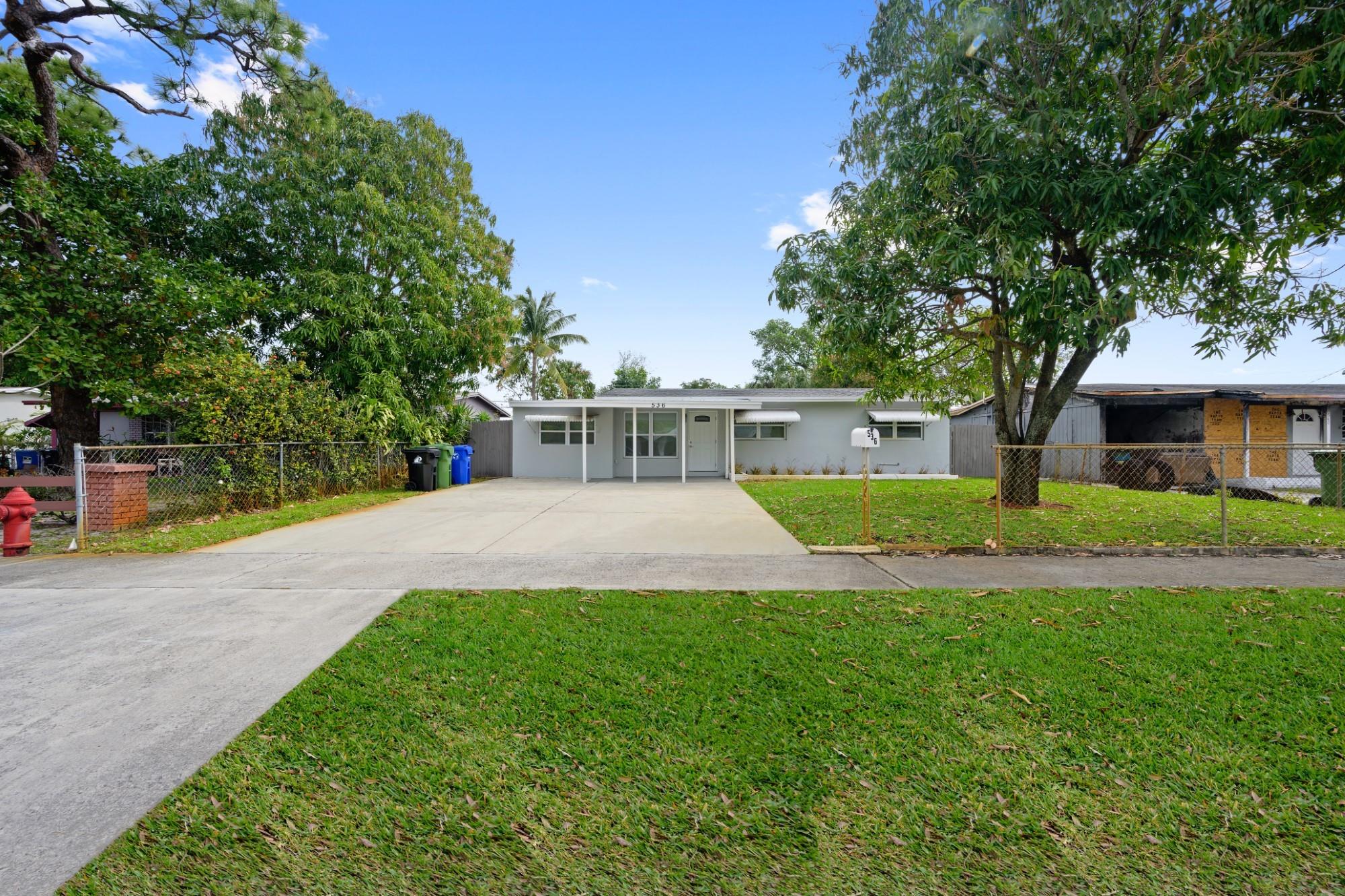 Welcome to Paradise. Experience the Fort Lauderdale lifestyle in this meticulously maintained home, centrally located near downtown, Fort Lauderdale International Airport, beaches, Las Olas, & shopping. This 3-bedroom 2-bathroom home features a thoughtfully designed open concept and split floor plan for separation & privacy. Highlights include a brand-new roof, quartz countertops, 2022 water heater, 2019 A/C, and Frigidaire black stainless appliance package. Relax on the covered porch or patio in your spacious, fully fenced yard. This beautiful home combines convenience, luxury & modern style. Pets are allowed.