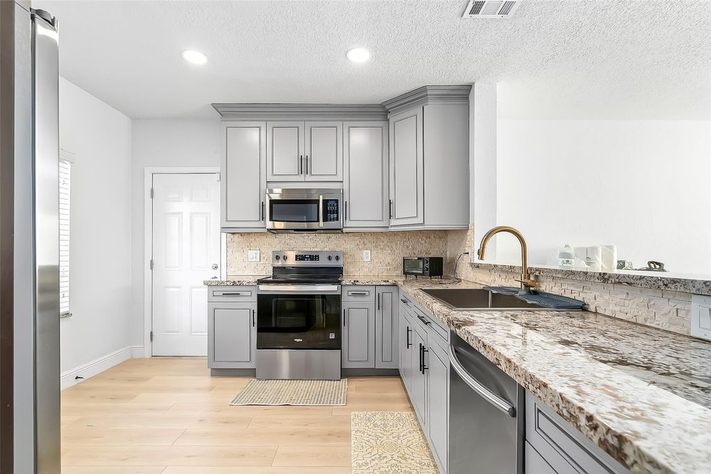 Photo of 9500 Stanley Lane, Tamarac, FL 33321 (MLS # F10546539)