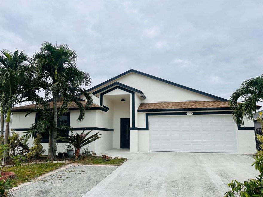 This newly renovated property is a beautiful oasis with fruit trees, Open patio, stainless steel appliances, Electric vehicle hook up in garage, natural gas cooking, all impact doors and windows. A must see ready to move in Nov 1.