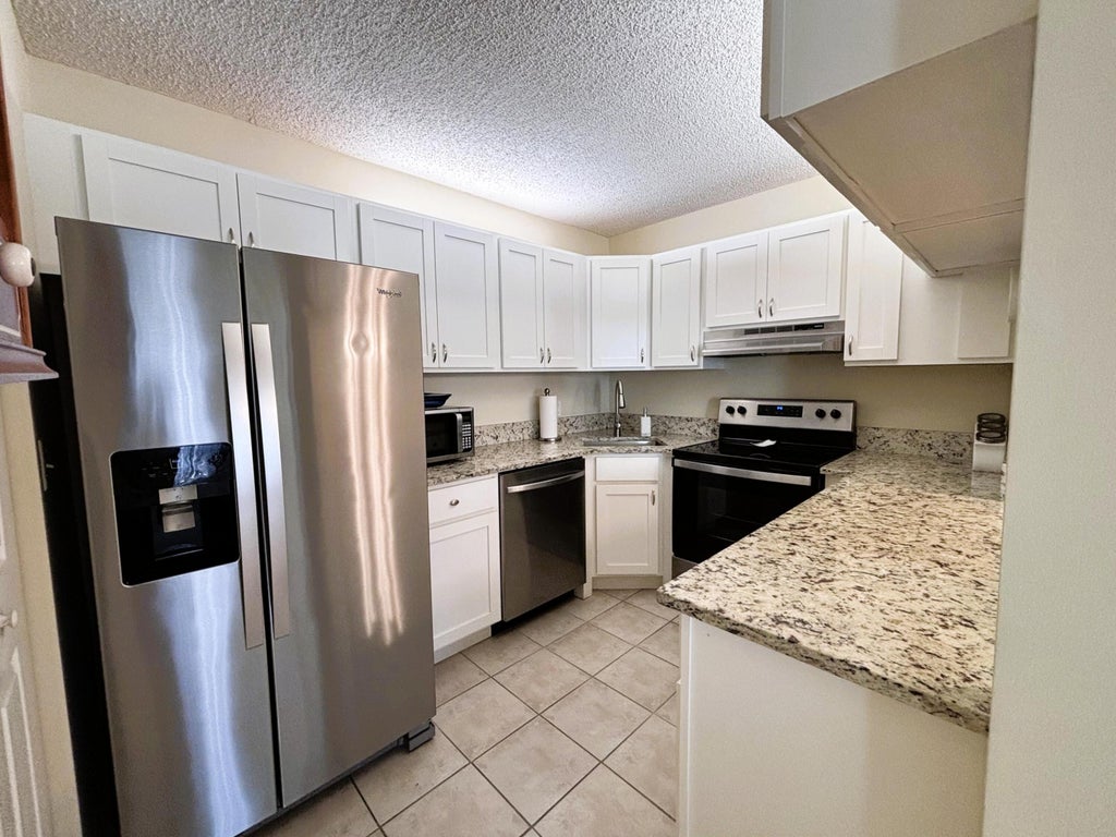 Photo of 2703 SW Matheson Avenue #116-C1, Palm City, FL 34990 (MLS # R11066900)