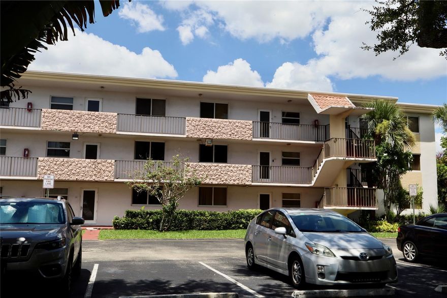 Step into this beautifully remodeled 2BR/2BA corner condo in Sunrise and instantly feel at home. Sunlight pours through impact windows, highlighting the open layout and peaceful water views that make every day feel relaxing. The kitchen features a brand-new stove and newer appliances, while the 3-year-old A/C, updated electrical panel, and tankless water heater mean you can move in with confidence. Enjoy the ease of a full-size washer and dryer inside your unit and parking right outside your door. The enclosed patio is perfect for morning coffee, quiet reading, or unwinding as the sun sets. Located in Waterbridge, a 55+ community with a pool, gym, tennis, and clubhouse. Close to shopping, dining, and highways. Schedule your private showing today!