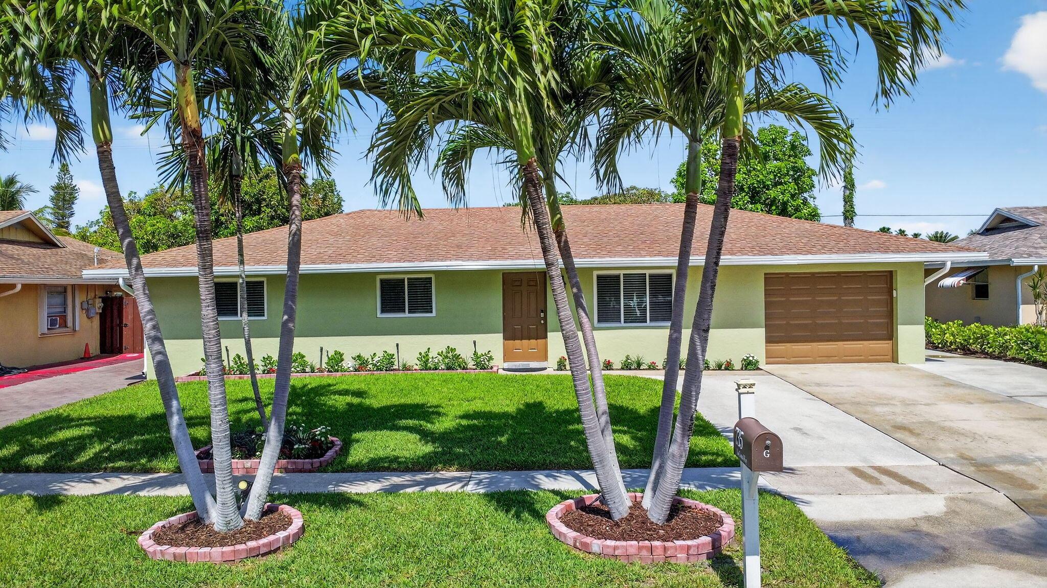 Fabulous, move in ready, no HOA, recently renovated home with natural light and a bonus den. Full house water filtration system. New bathrooms and kitchen with wood cabinetry, quartz countertop and SS appliances. New tile flooring throughout, with upgraded lightning fixtures, and ceiling fans. Brand new doors and hardware. Garage with new epoxy floors. Has impact windows and doors. Expanded driveway with secondary paver for lots of parking including a boat and RV. Golf cart friendly neighborhood, drive it to the beach! Complete fenced back yard with large concrete patio and hot tub! Comes with shed and a great avocado tree.Blocks from beach, I-95, restaurants, schools, etc.