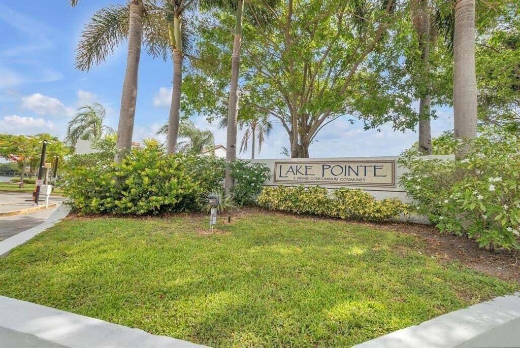 Photo of 207 LAKE POINTE Drive #102, Oakland Park, FL 33309 (MLS # B26092235)