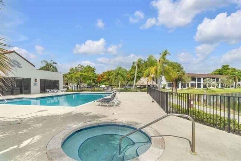 Photo of 207 LAKE POINTE Drive #102, Oakland Park, FL 33309 (MLS # B26092235)
