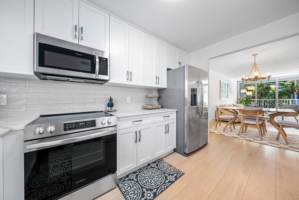 Photo of 621 E Woolbright Road #B407, Boynton Beach, FL 33435 (MLS # B26063887)