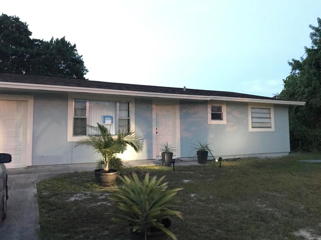 Photo of 343 SE Oakridge Drive, Port Saint Lucie, FL 34952 (MLS # R11130569)