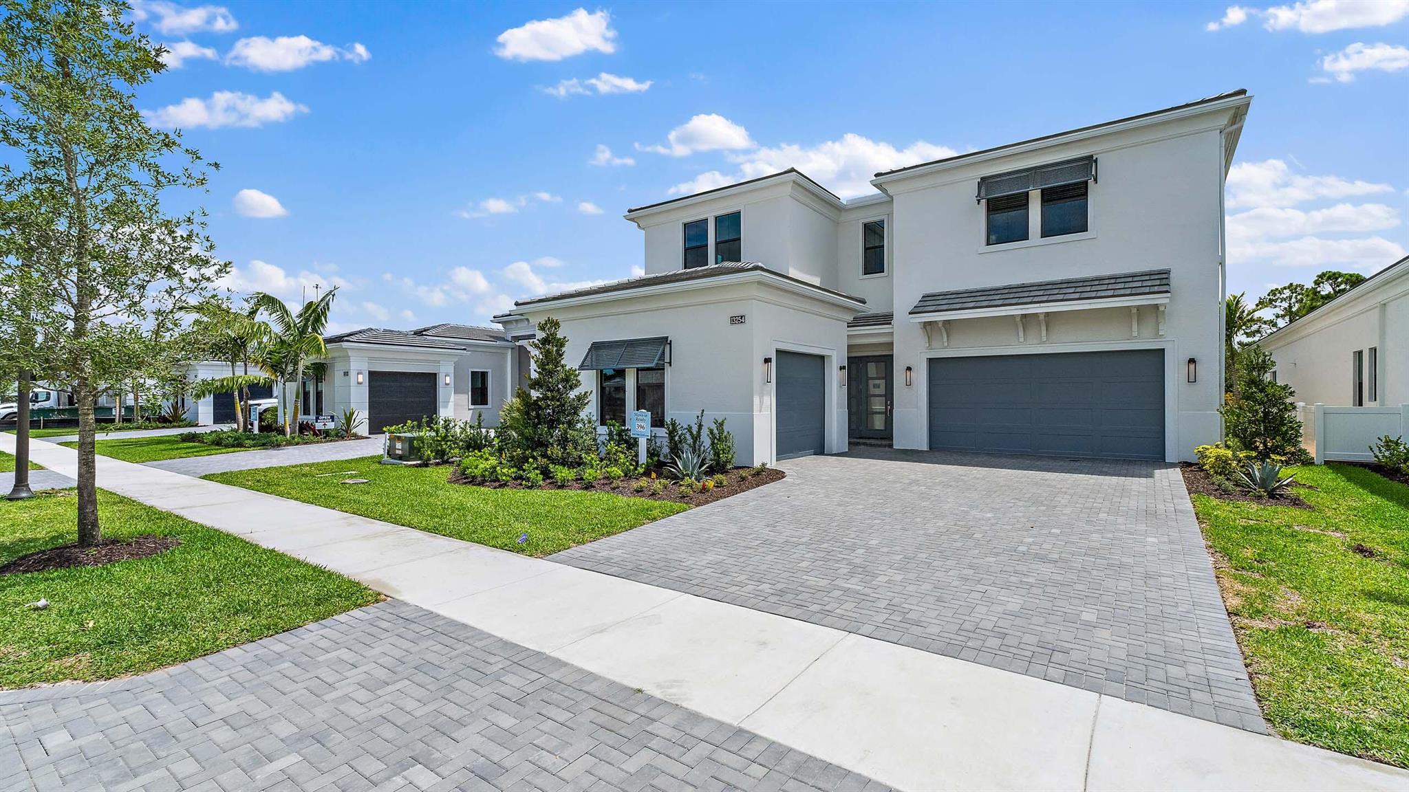 **New Construction** This brand-new Mondrian floorplan is situated on a private, preserve view homesite within Artistry Palm Beach. This home offers 4-bedroom suites, each with their own bathroom, an additional half bathroom and a split-3 car garage. This Mondrian also includes gas cooking in the kitchen, 2nd tier upper cabinets and under cabinet LED lighting. The house has the loft converted to the larger game room upstairs with a dry bar added. There is an upgraded 20 foot wide by 10-foot-tall sliding glass door, and an electric fireplace in the great room. The owner's suite has an enlarged wardrobe and the is a gas connection for a future pool heater, and a tankless gas water heater.