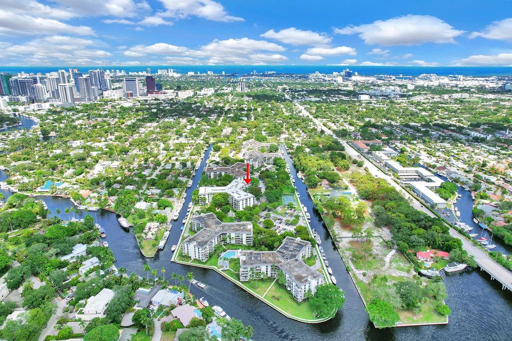 LARGEST MODEL IN RIVER REACH 1,500 SQ FT + BALCONY, CORNER ASTOR MODEL W/COVERED PARKING! VIEW OF TENNIS COURT & BOATS ON CANAL FROM THIS LIGHT & BRIGHT CONDO W/GREAT SOUTHERN EXPOSURE! NEWER KITCHEN WITH WHITE/GRAY SHAKER CABINETS NICELY ACCENTED WITH BLACK & WHITE GRANITE COUNTERTOPS, TILE BACKSPLASH & STAINLESS STEEL APPLIANCES. JACUZZI TUB, TANKLESS HOT WATER HEATER, NEWER A/C, BUILT-IN MURPHY BED & WALL UNITS. WATERFRONT PRIVATE ISLAND - 24 HR MANNED GUARDHOUSE, POOLS, TENNIS/PICKLEBALL, GYM & KAYAK/PADDLEBOARD RACKS. 2 PETS -20 LBS EACH OK, DOCK TO 50' AS AVAILABLE. 1201 BUILDING COMPLETED IMPACT DOORS/WINDOWS, NEW BALCONY RAILINGS, CONCRETE RESTORATION & BRAND NEW ROOF! SPECIAL ASSESSMENTS PAID BY SELLER. JUST MINUTES TO DOWNTOWN/LAS OLAS, BEACH, RESTAURANTS, AIRPORT & EXPRESSWAYS!