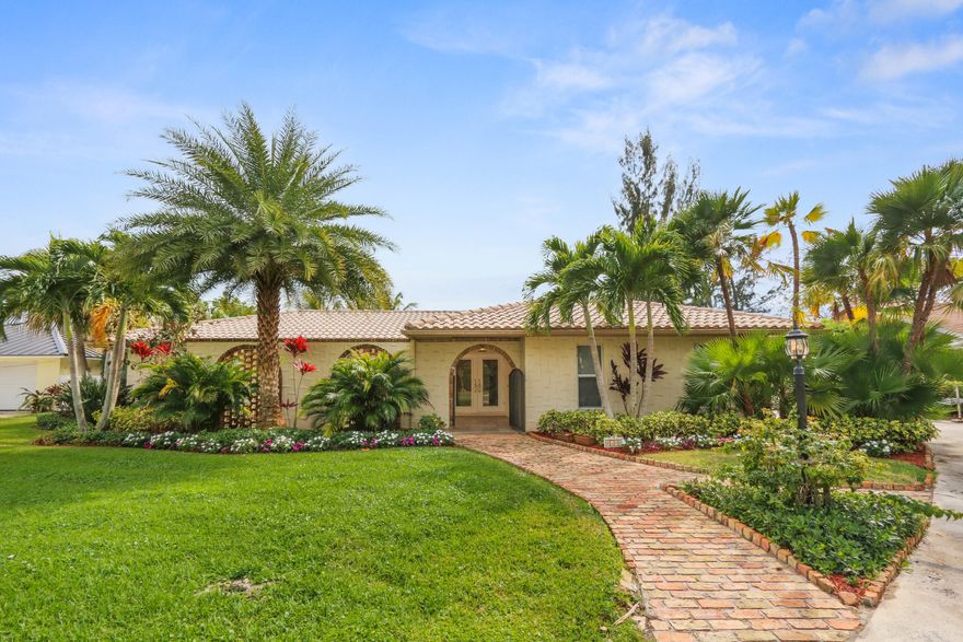 This spectacular 1/2 acre, southern exposure lot is tucked away in a serene section of the Loxahatchee River. The property features a beautiful (recently renovated) 3 bed 2 bath home, true resort style backyard capable of hosting the most memorable of events, 100ft of waterfront, gorgeous dock with a 16,000lb lift. Other highlights include, new bamboo flooring throughout the living area, impact windows, upgraded kitchen with new blacksplash, stainless appliances, and cooktop island, fireplace,  upgraded landscaping including turf , fire pit sand area, salt-water pool system, and outdoor tiki hut areas. Very short trip to the Jupiter Inlet, one fixed bridge with approximately 22ft clearance at high tide. WATCH THE VIRTUAL TOUR