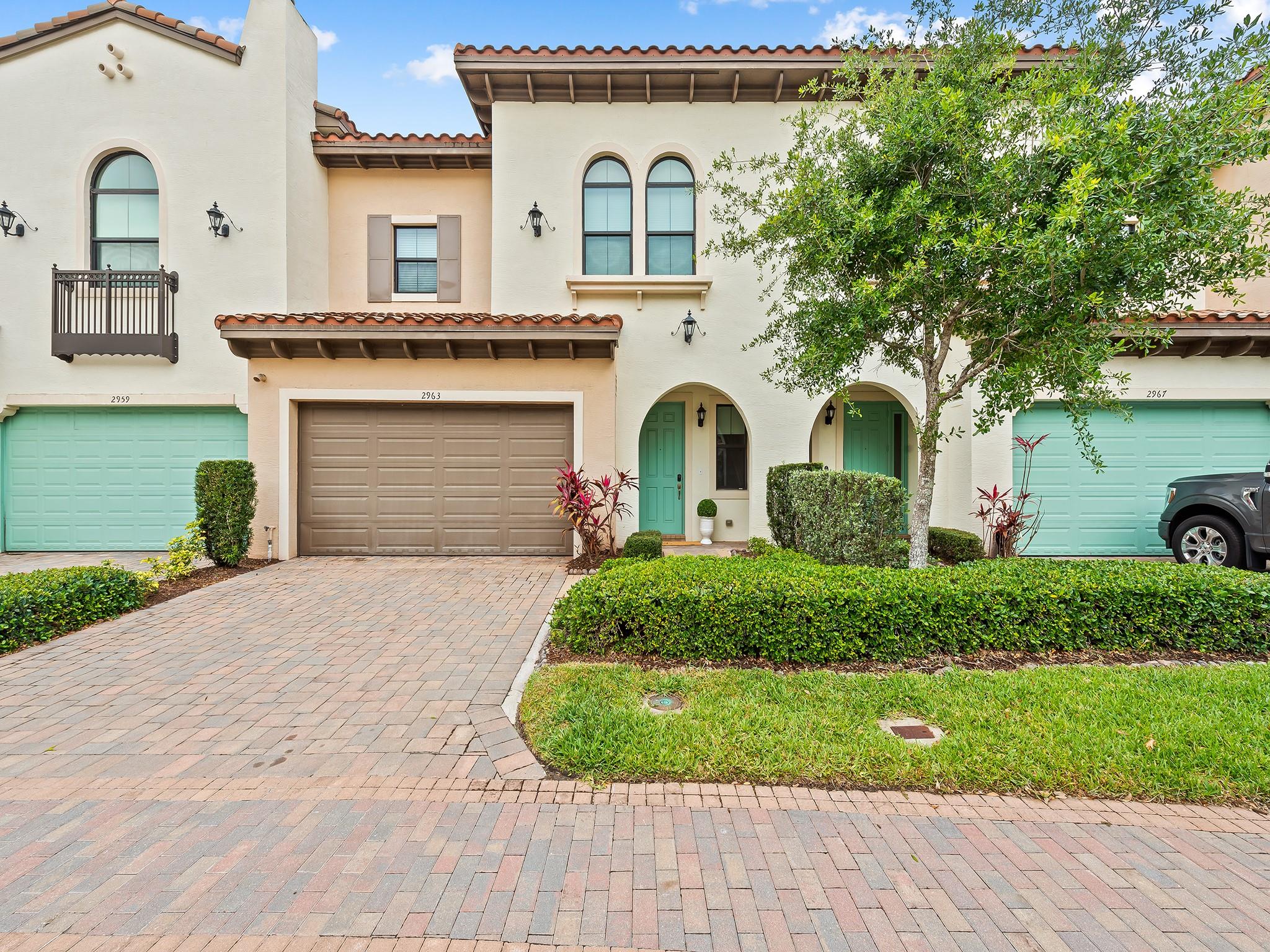 Everything about this 3/2.5 townhouse, 2 car garage is about the best of South Florida living at the most convenient spot to get anywhere in South Florida. Tucked away in it's own haven, this Artesia home is move in ready. Ten foot ceiling on first and second floor, big big kitchen island, large living room and dining areas lead to lovely personal outdoor space. This is a pet friendly, outdoor loving community from pickle ball, tennis and the beautiful a/c half court basketball, gym over looking the pool, clubhouse with grand palm fountain lined walking path around the cabana's and 3 pools. This is a do not miss.