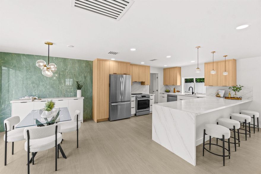 STEP INTO LUXURY LIVING AT IT'S FINEST IN THIS COMPLETELY REMODELED 4 BEDROOM, 4 FULL BATH HOME w/ STUNNING DESIGNER FINISHES RIGHT OFF HGTV! NEUTRAL ITALIAN FLOORING THROUGHOUT AND MANY LARGE HURRICANE IMPACT WINDOWS ALLOW LOTS OF NATURAL LIGHT TO STREAM THROUGH MAKING THE HOME SUPER BRIGHT! STUNNING CUSTOM KITCHEN HAS A 12 ft QUARTZ PENINSULA w/ WATERFALL (room for 5 barstools) & A PASS THROUGH WINDOW OUT TO THE POOL...PERFECT HOME FOR ENTERTAINING! EACH CUSTOM DESIGNED BATHROOM IS MORE BEAUTIFUL THAN THE LAST...IMPECCABLE ATTENTION TO DETAIL ON EVERY CUSTOM FINISH. A FULLY FENCED MASSIVE BACK YARD w/ HUGE SPARKLING BLUE POOL & CABANA BATH. ENCLOSED CARPORT. CHAPEL HILL IS A HIGHLY DESIRED NEIGHBORHOOD MINUTES TO DOWNTOWN DELRAY & 2 MILES TO THE BEACH